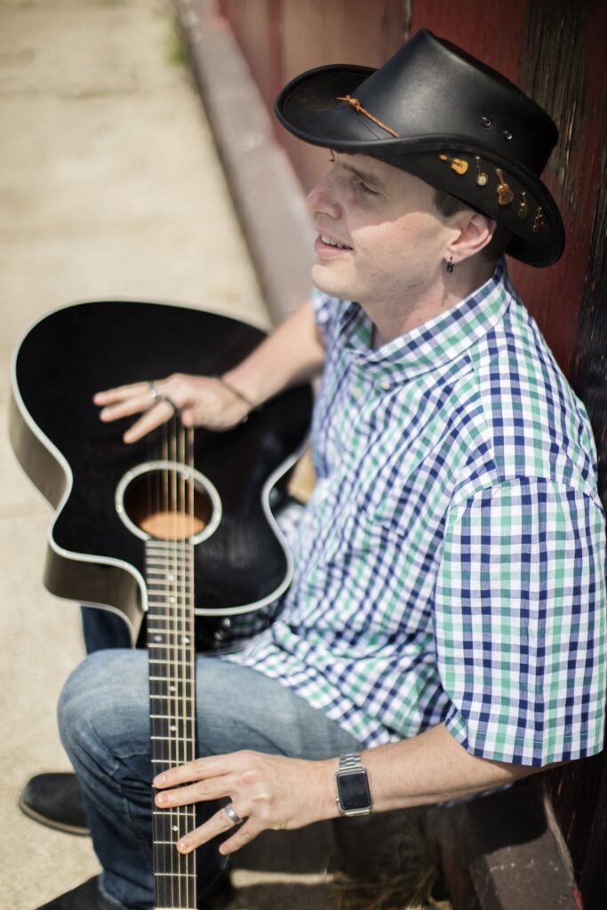 Blind Joe with his guitar
